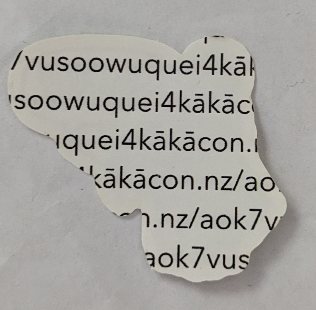 Back of the 2022 Kākācon sticker. The details of what is on the back is discussed just below.